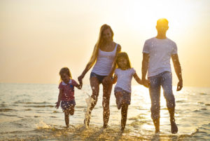Picture of a Family of Four Walking on the Beach