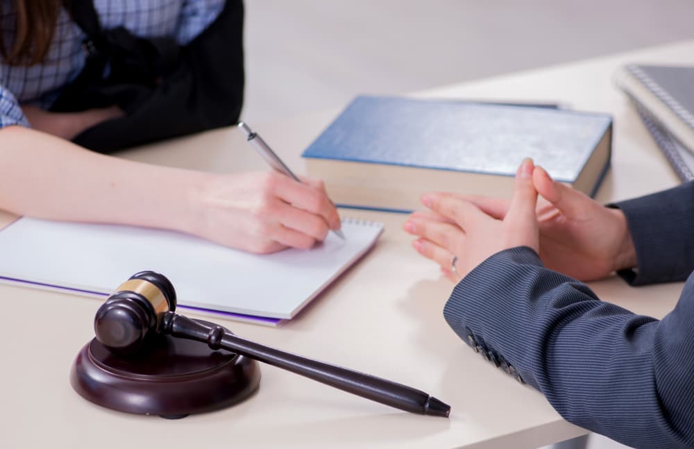 An injured employee seeks counsel from a lawyer for guidance on insurance matters.