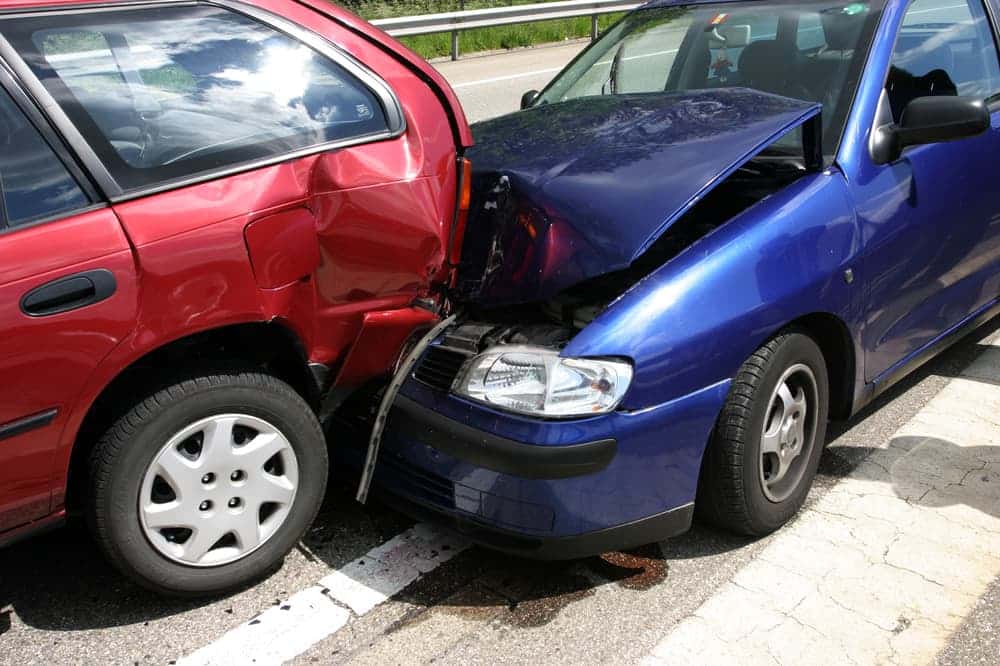 Two cars severely damaged in a collision.